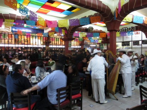 Those are jarocho guys, with the harp. Mariachis lurk in every other corner.