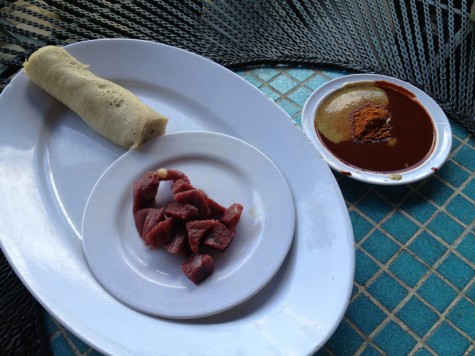 We got the pre-cut version for our table. Comes with red chile sauce and mustard, for dipping. (We also got cooked beef cubes, which were easier to compare in flavor to American beef. Guess what--Ethiopian is much better.)